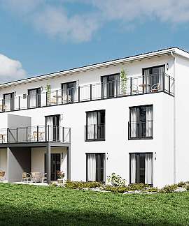 Weißes modernes Mehrfamilienhaus mit Balkonen und Garten bei sonnigem Himmel.