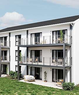 Weißes Mehrfamilienhaus mit Balkonen, Garten und Terrasse
